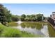 Serene community pond with a fountain and footbridge at 401 16Th Nw St # 1157, Atlanta, GA 30363