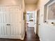 Bright hallway with wood-look floors and access to closets and other rooms at 401 16Th Nw St # 1157, Atlanta, GA 30363