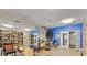 Common area with tables, chairs, and bookshelves at 401 16Th Nw St # 1157, Atlanta, GA 30363