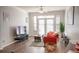 Living room with hardwood floors, a comfy sofa and large TV at 401 16Th Nw St # 1157, Atlanta, GA 30363