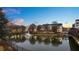 Evening view of apartment community by a pond with fountain at 401 16Th Nw St # 1157, Atlanta, GA 30363
