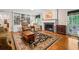 Living room with hardwood floors, built-in shelving and fireplace at 2690 Hideaway Hills Sw Ln, Powder Springs, GA 30127