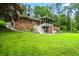 Brick house exterior with large backyard and screened porch at 2690 Hideaway Hills Sw Ln, Powder Springs, GA 30127