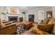 Living room with hardwood floors, fireplace, and comfortable seating at 2690 Hideaway Hills Sw Ln, Powder Springs, GA 30127