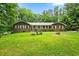 Brick ranch house with large yard and mature trees at 2690 Hideaway Hills Sw Ln, Powder Springs, GA 30127