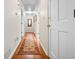 Hardwood floors and a decorative area rug in the hallway at 2690 Hideaway Hills Sw Ln, Powder Springs, GA 30127