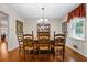 Dining room with hardwood floors and wooden table set at 2690 Hideaway Hills Sw Ln, Powder Springs, GA 30127