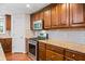 Modern kitchen in the basement with stainless steel appliances at 2690 Hideaway Hills Sw Ln, Powder Springs, GA 30127