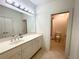Bright bathroom with double vanity, shower, and toilet at 4070 Annecy Sw Dr, Atlanta, GA 30331