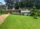 Two-story house with gray siding and green lawn at 2492 Brentwood Ct, Decatur, GA 30032