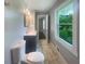 Modern bathroom with double vanity and marble-look tile floor at 2492 Brentwood Ct, Decatur, GA 30032