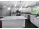 Modern kitchen with white cabinets and a large island at 2492 Brentwood Ct, Decatur, GA 30032