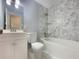 Clean bathroom with white vanity, toilet, and marble tile shower at 2492 Brentwood Ct, Decatur, GA 30032