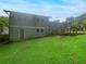 Two-story house with gray siding, deck and green lawn at 2492 Brentwood Ct, Decatur, GA 30032