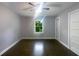 Spacious bedroom with dark hardwood floors and ceiling fan at 2492 Brentwood Ct, Decatur, GA 30032