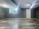 Finished basement with gray walls and vinyl flooring at 2492 Brentwood Ct, Decatur, GA 30032