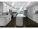 Modern kitchen with white cabinets, stainless steel appliances, and an island at 2492 Brentwood Ct, Decatur, GA 30032