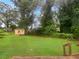 Large backyard with storage shed and green lawn at 2492 Brentwood Ct, Decatur, GA 30032