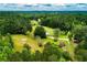 Aerial view of property with home and outbuildings at 3545 Liberty Rd, Villa Rica, GA 30180