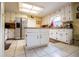 Kitchen with white cabinets, a center island, and stainless steel appliances at 3545 Liberty Rd, Villa Rica, GA 30180