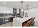 Modern kitchen with white and gray cabinets and a large island at 788 W Marietta Nw St # 1416, Atlanta, GA 30318