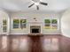 Spacious living room with hardwood floors, stone fireplace, and large windows at 119 Gatlin Ridge Run, Dallas, GA 30157