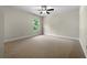 Bedroom with ceiling fan, window and neutral carpeting at 119 Gatlin Ridge Run, Dallas, GA 30157