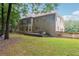 Two story house exterior with a hot tub and deck at 6925 Keswick Ct, Cumming, GA 30040
