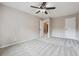 Bedroom with ceiling fan and access to upper hallway at 6925 Keswick Ct, Cumming, GA 30040