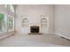 Spacious Gathering room with stone fireplace and built-in shelves at 6925 Keswick Ct, Cumming, GA 30040