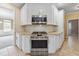 Modern kitchen features stainless steel appliances and granite countertops at 6925 Keswick Ct, Cumming, GA 30040