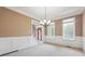 Bright dining room with chandelier and view of entryway at 6925 Keswick Ct, Cumming, GA 30040