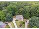 Two-story home nestled in a wooded lot with a large yard at 6925 Keswick Ct, Cumming, GA 30040