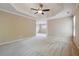 Spacious main bedroom with large windows and carpet at 6925 Keswick Ct, Cumming, GA 30040