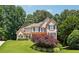Two-story home with stone accents and landscaping at 6925 Keswick Ct, Cumming, GA 30040