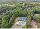 Aerial view of community pool, tennis courts, playground at 6925 Keswick Ct, Cumming, GA 30040