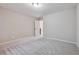 Small bedroom with door to hallway at 6925 Keswick Ct, Cumming, GA 30040