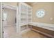Laundry room with built-in shelving and workspace at 6925 Keswick Ct, Cumming, GA 30040