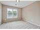 Bright bedroom with neutral walls and carpet flooring at 6925 Keswick Ct, Cumming, GA 30040