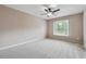 Spacious bedroom with ceiling fan and neutral decor at 6925 Keswick Ct, Cumming, GA 30040