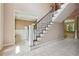 Elegant entryway with tiled floors and staircase at 6925 Keswick Ct, Cumming, GA 30040