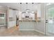 Modern kitchen with white cabinets, granite counters, and stainless steel appliances at 6925 Keswick Ct, Cumming, GA 30040
