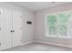 Bedroom with double doors and large window at 6925 Keswick Ct, Cumming, GA 30040