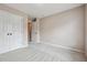 Spacious bedroom with double doors and neutral decor at 6925 Keswick Ct, Cumming, GA 30040