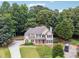 Two-story home with stone accents and landscaping at 6925 Keswick Ct, Cumming, GA 30040
