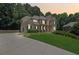 Two-story home with stone accents and landscaping at 6925 Keswick Ct, Cumming, GA 30040