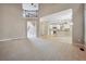 Open Gathering room with view of kitchen and staircase at 6925 Keswick Ct, Cumming, GA 30040