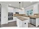 Spacious kitchen with island, stainless steel appliances, and granite countertops at 1216 Trophy Club Ave, Dacula, GA 30019