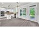 Open concept dining area with hardwood floors and kitchen views at 1216 Trophy Club Ave, Dacula, GA 30019