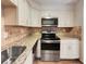 Kitchen with granite countertops and stainless steel appliances at 2416 Peachwood Ne Cir # 9, Atlanta, GA 30345